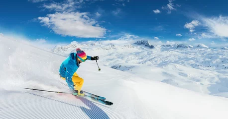 Rolgordijnen Alpine skier skiing downhill, panoramic format © Jag_cz