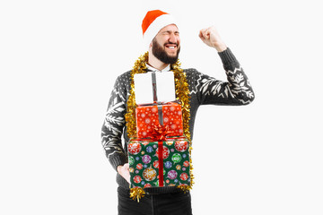 A man with a Christmas gift in his hands, in the Studio on a white background