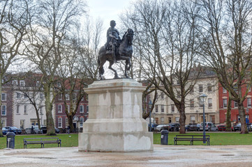 Equestrian statue of William III in Queen Square in Bristol, United Kingdoms, just after a storm in a winter day
