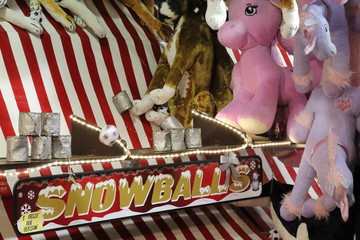 Stacked jars being hit by a ball, among stuffed animals, in an attraction in the Gorsedd Gardens amusement park in Bristol, United Kingdom