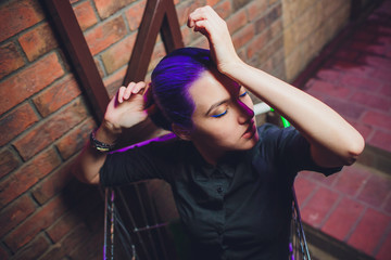 Sale, purchase, black Friday. Girl shopper sit in shopping cart. Shopping, shop, shopaholic. Fashion woman, beauty, look, makeup, hair. girl with blue hair © Евгений Вершинин