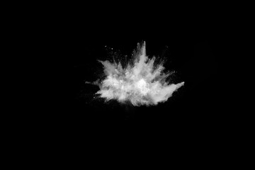 White powder explosion on black background. Colored cloud. Colorful dust explode. Paint Holi.