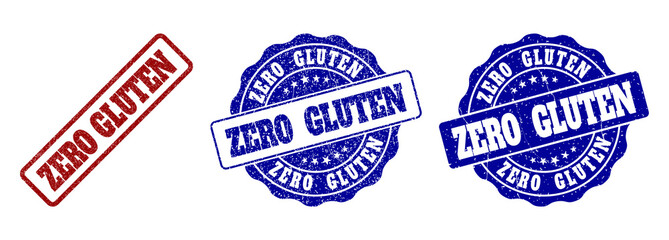 ZERO GLUTEN scratched stamp seals in red and blue colors. Vector ZERO GLUTEN labels with grunge effect. Graphic elements are rounded rectangles, rosettes, circles and text labels.