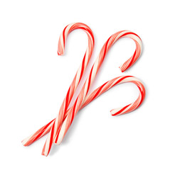 Tasty candy canes on white background. Festive treat