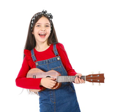 Portrait of little girl playing guitar, isolated on white