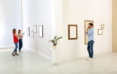 Fototapeta premium People viewing exposition in modern art gallery