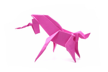 Unicorn : Origami pink unicorn. Isolated on white background. © Cheattha
