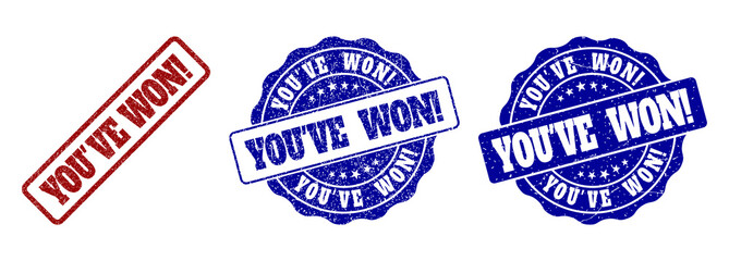 YOU'VE WON! grunge stamp seals in red and blue colors. Vector YOU'VE WON! imprints with grunge surface. Graphic elements are rounded rectangles, rosettes, circles and text titles.