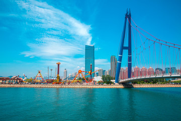 Dalian Xinghai Square and the sea bridge - obrazy, fototapety, plakaty