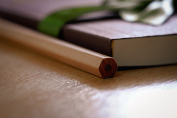 Book diary to give souvenirs placed on wooden table.