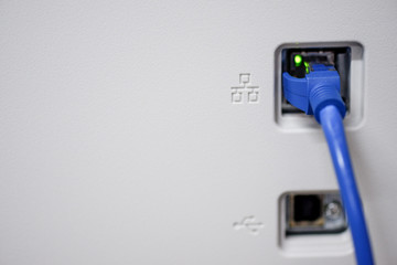 Close Up ethernet cable connected to the Lan port  for computer network concept.
