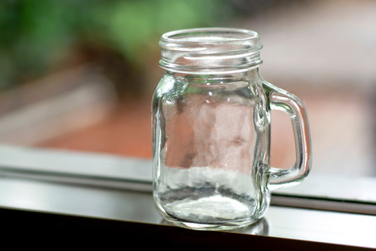 Empty glass jug on background blurred, Clear bottle, Beer mug.