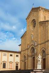 Fototapeta na wymiar Beautiful Arezzo gothic Cathedral with renaissance monumento to Ferdinando I Medici, Grand Duke of Tuscany, in the city historic center