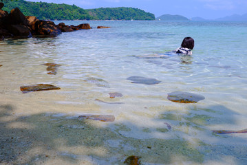 Thai girl relaxing in the sea, Enjoying a seaside of Thailand.