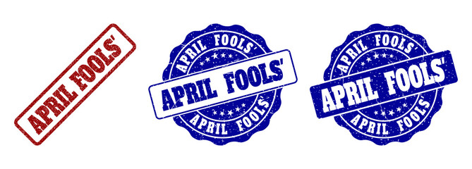 Obraz premium APRIL FOOLS' grunge stamp seals in red and blue colors. Vector APRIL FOOLS' labels with grunge surface. Graphic elements are rounded rectangles, rosettes, circles and text labels.