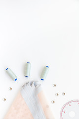 Tailor shop with thread, fabric. Sewing as hobby. White background top view mockup