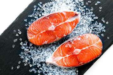 Fresh salmon steak for cooking healthy food on white background top view