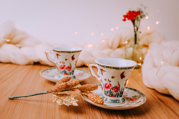 Christmas Cozy Table, Chrismas Decoration With Coffee and Tea, Mugs, Plants and Flowers, Notebook