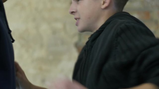 High school students cruelly mocking and scoffing at schoolboy, teen cruelty