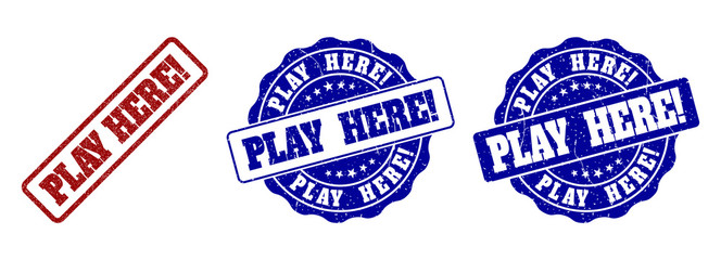 PLAY HERE! scratched stamp seals in red and blue colors. Vector PLAY HERE! labels with grunge surface. Graphic elements are rounded rectangles, rosettes, circles and text labels.