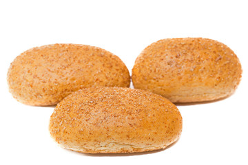 Fototapeta na wymiar three dietary buns on a white background. bun of wholegrain 