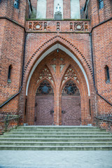 Obraz premium Double doors of the main entrance. Garrison Church in Olsztyn, Poland