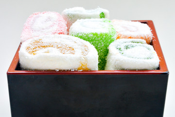 Delicious rolls of Lokum with fruit marmalade in japanese style in black box