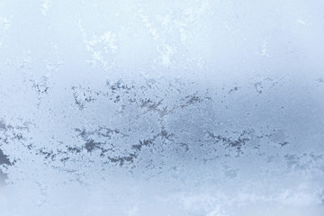 Frosty pattern on the glass. The figure is made of cold air.