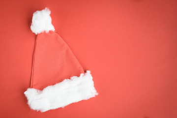 Christmas hat on red background.