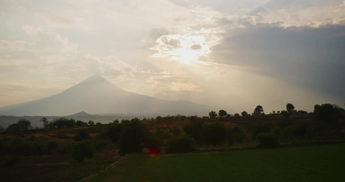 Sunset time of smoke flowing out of Popocatepetl Volcano in Puebla, Mexico. 