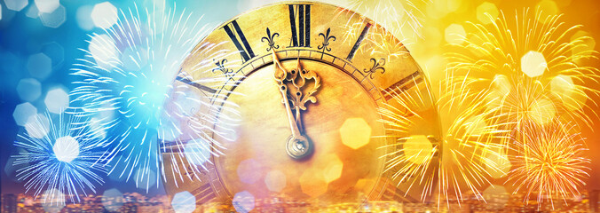 Fototapeta na wymiar Retro clock close to midnight, fireworks and lights. New Year's and Christmas holiday background.