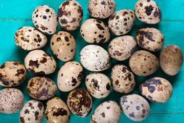 Quail eggs on wooden background