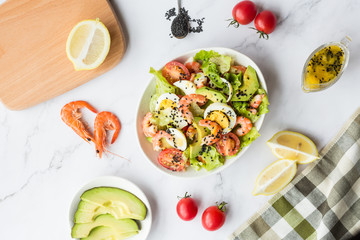 Fresh salad lying in white plate