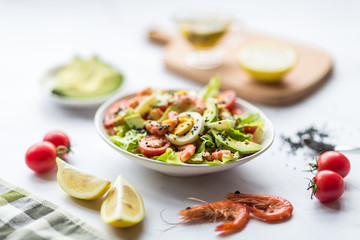 Fresh salad lying in white plate