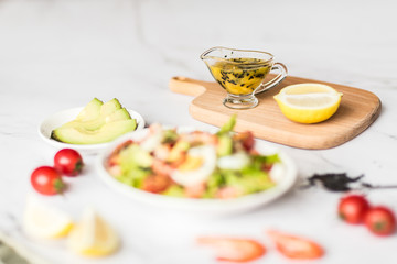 Fresh salad lying in white plate