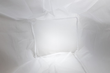 Abstract background of ethylene-vinyl acetate (EVA) material. Inside view of a white plastic bag.