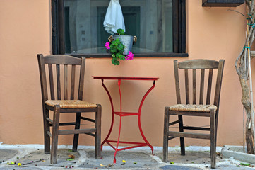 Fototapeta na wymiar Two chairs and table at the house