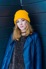 beautiful woman in yellow hat and blue jacket