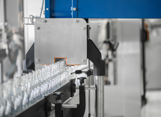 empty plastic bottles on conveyor belt. equipment at the dairy plant