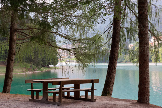 cozy place. table and bench by the lake.