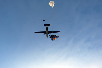 Skydiving. Tandem jump with happy girl.