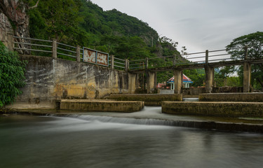 Fototapeta na wymiar Water flowing from the dam, catchment area in countryside Thailand