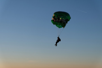 A parachute is in the sky.