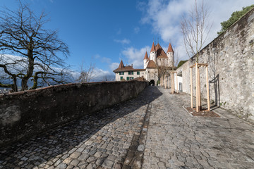 Street in old town of Thun (BE, Switzerland) on a clear winter day with a view on Thun Castle