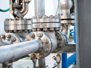 series of joints with flanges and bolts on an industrial pipe line