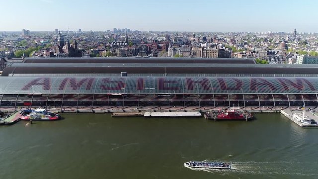 Aerial footage of Amsterdam main railway station is one of largest in Netherlands and major international hub it is used by 162000 passengers a day making it the second busiest in the country 4k