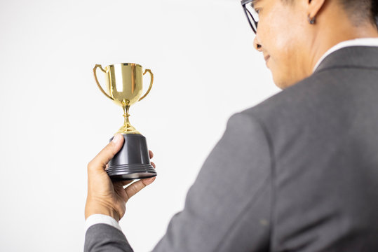 Businessman holding star award in business concept