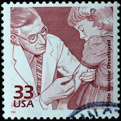Doctor injecting polio vaccine on american postage stamp - obrazy, fototapety, plakaty