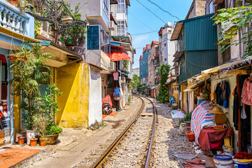 Hanoi city railway Perspective view running along narrow street with houses in Vietnam - obrazy, fototapety, plakaty