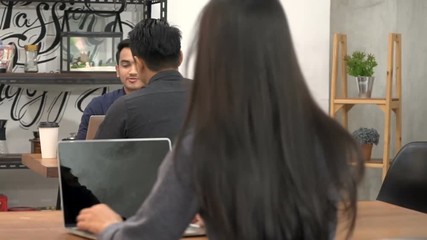 businessman working on laptop in cafe